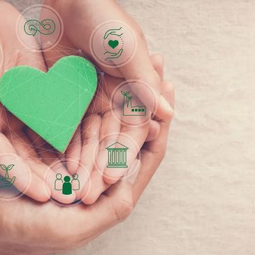 Picture of a heart with different supports surrounding it is held in someone's hand