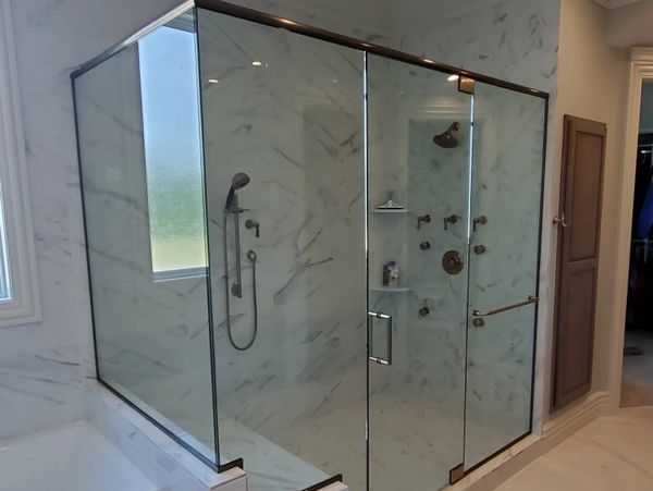 Residential custom glass shower enclosure installed 