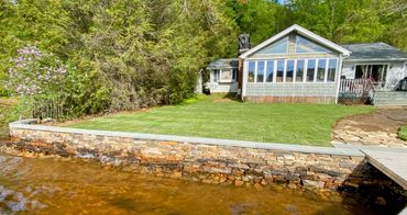 Stone retaining wall on lake in Holland, MA