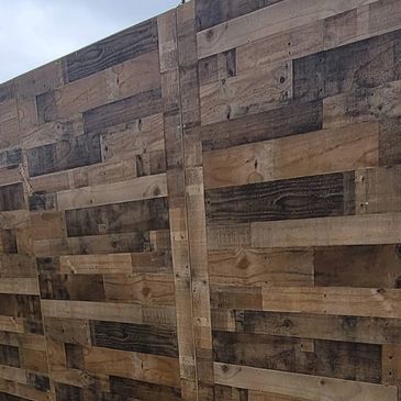 Rustic wood wall or whiskey wall rental for wedding in New Orleans. Calfee Productions.