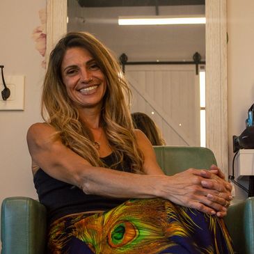 Color Specialist Marcie sitting in the hair salon