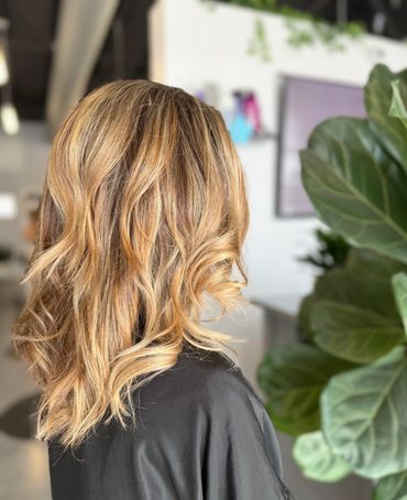Side view of a client with blond highlights