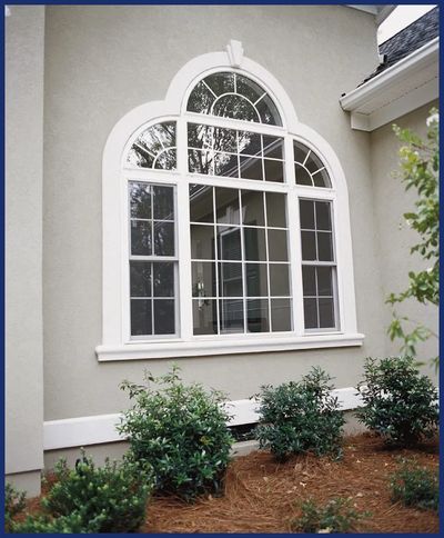 E Home Improvements installing new windows.