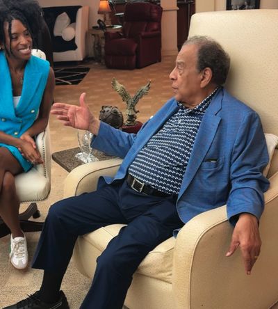 Andrew Young and Chelsea Addison discussing the importance of financial literacy.