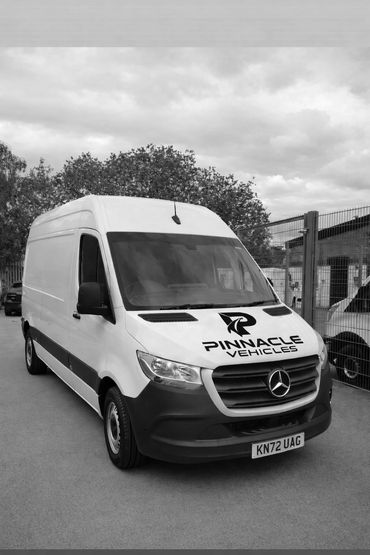 White Mercedes van with Pinnacle Vehicles logo on the hood.