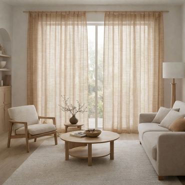 Minimalist living room with neutral tones and natural wood furniture.