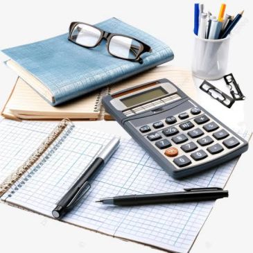 Calculator, notebooks, glasses, and pens on a desk.