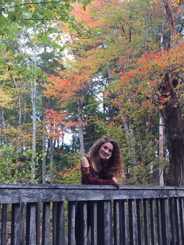 My profile picture taken in the fall on a bridge in the woods