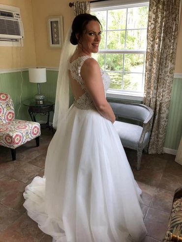 Bride in bespoke fingertip veil with Swarovski