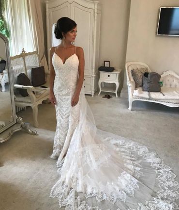 Bride wearing bespoke cathedral length veil with Swarovski crystals