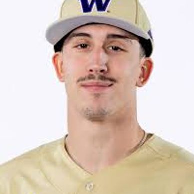 Young baseball player in uniform and cap.