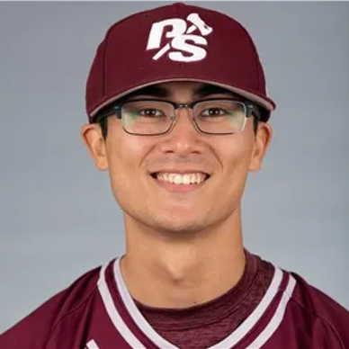 Young man wearing glasses and a maroon sports cap and jersey.