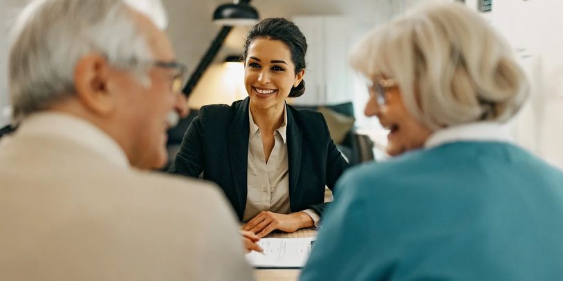 A scenic landscape with mountains, trees, and a clear blue sky, reflecting natural tranquility.