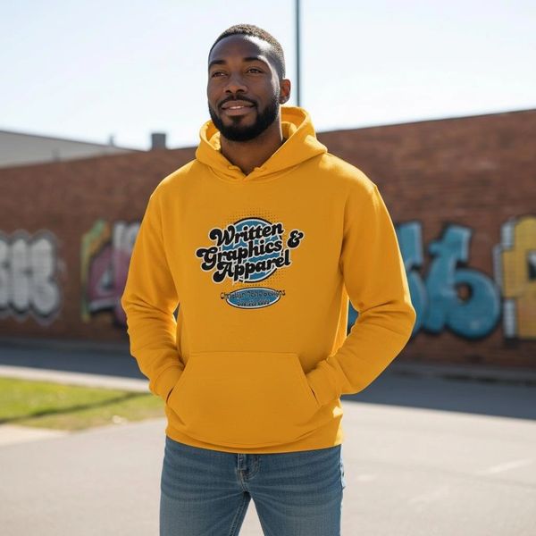 Man wearing a yellow T shirt with jeans and looking ahead