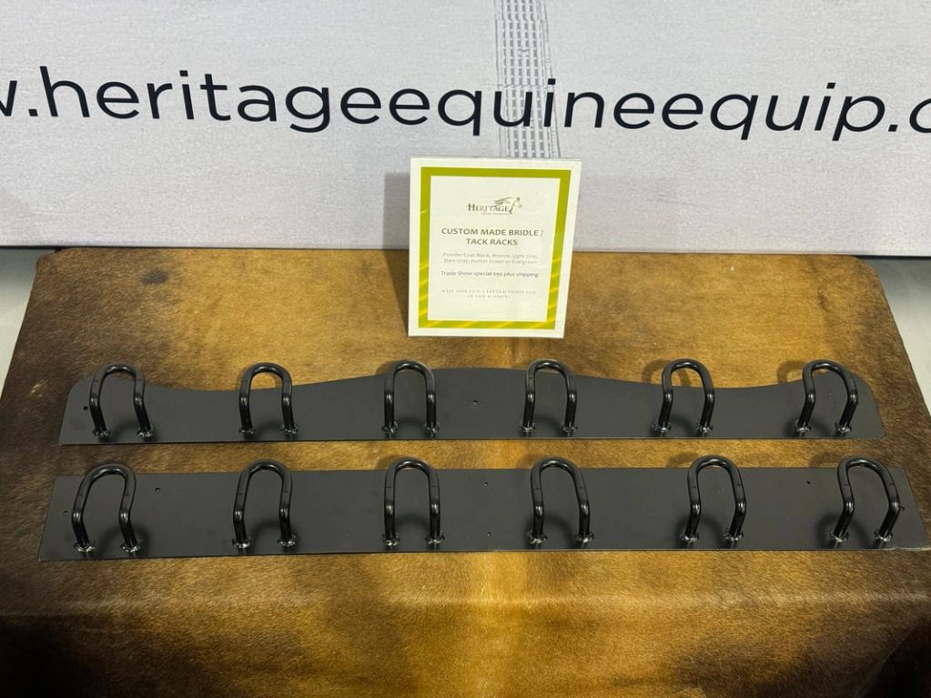 Custom made bridle and tack racks displayed on a brown surface.
