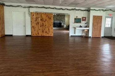 Large hall - ready for tables and chairs which are provided in the rental fee