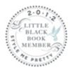 Emblem for 2012 Little Black Book Member with decorative border.