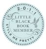 Seal reading '2011 Little Black Book Member' with decorative elements.