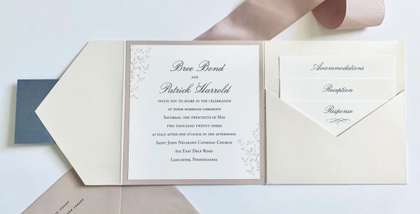 Elegant wedding invitation with names, date, and venue details.