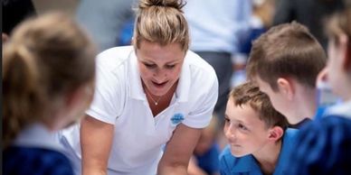 Educator shares insights with students in hands on activity plastic pollution Ali Foley engagement