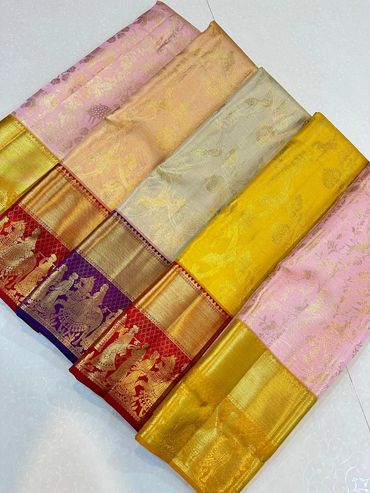 Elegant silk sarees with intricate golden borders and traditional motifs.