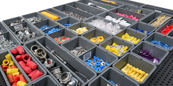 side image of tool grid containers filled with pieces on a tool grid board