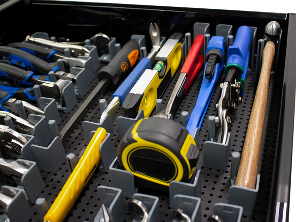 many different tools in the tool grid system on a tool grid board, in a toolbox drawer