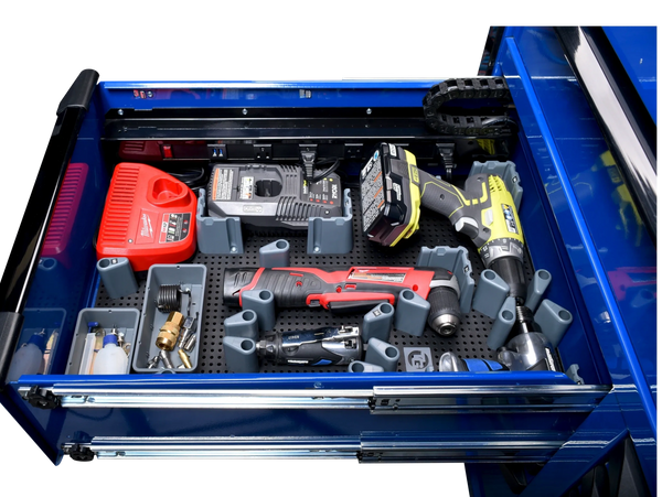 tool box drawer open showing heavy tools in the tool grid system inside