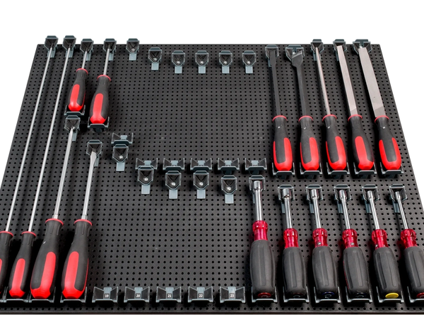 screwdrivers in tool grid system on a tool grid board, some screwdrivers removed from holders