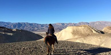 A rider looks across the foothills of the Funeral Mountains.