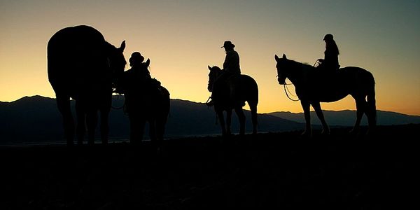 Riders at sunset.