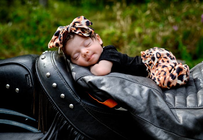 Newborn session on daddys motorcycle