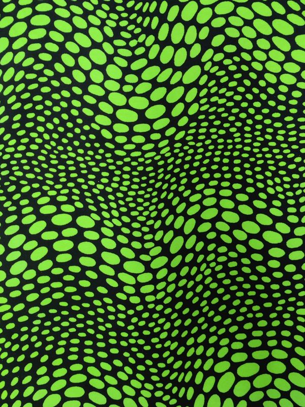 Wavy lime circles printed on black fabric.