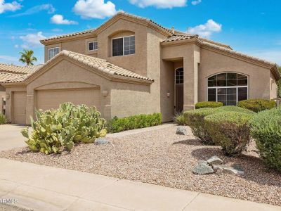 Southwestern-style Phoenix home with desert landscaping representing residential appraisal services.
