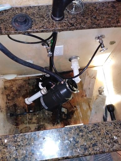 leak under sink caused floor damage