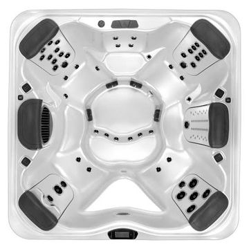 Top view of a white six-seat hot tub with black headrests.