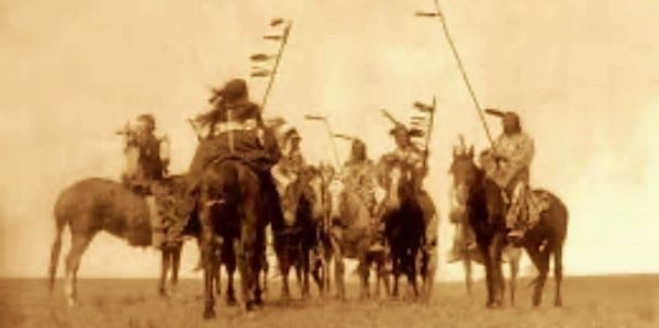 Native American warriors on horseback.