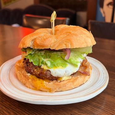 Big Will's Breakfast - Beef patty*, smoked bacon, over easy egg*, red onion, green leaf lettuce, hon