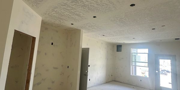 Room under construction with unfinished walls and ceiling.