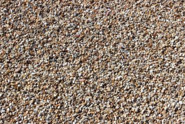 Close-up of a surface covered in small, multicolored pebbles.