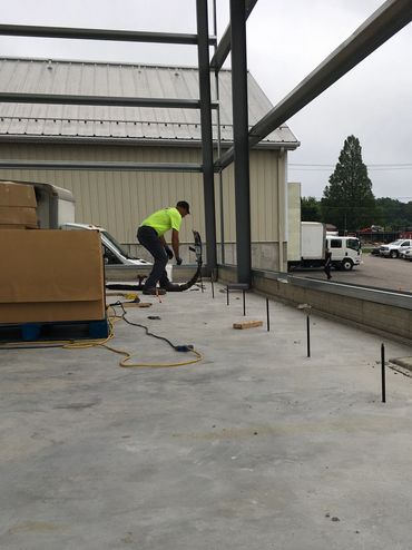 Concrete raising in action on a warehouse floor using Deep Foamjection™