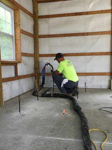 Concrete raising in action on a building interior floor using Deep Foamjection™