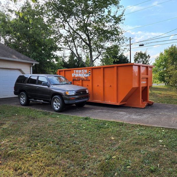 Rear door entry on Trash Panda dumpsters for easy loading