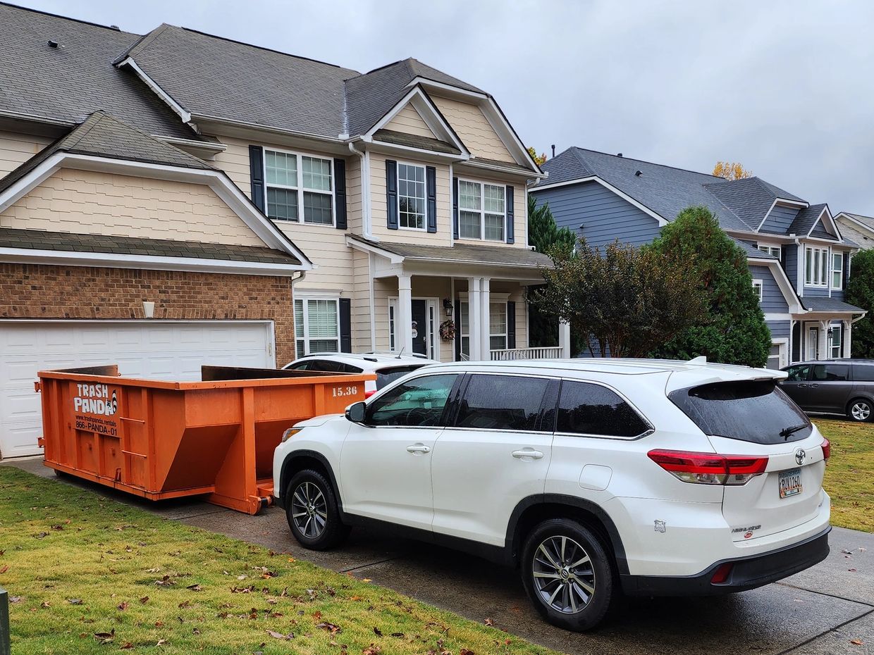 Trash Panda dumpster in driveway — residential-friendly placement.