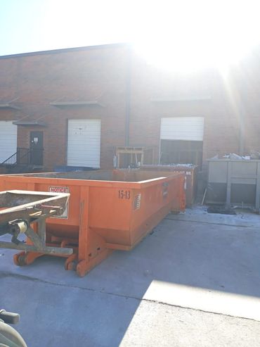 15 yard dumpster at warehouse loading dock
