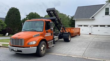 15 yard dumpster rental being delivered in Buford, GA