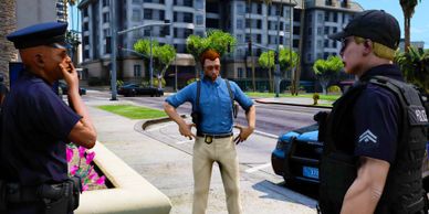 Detective talking to an officer and a beat cop