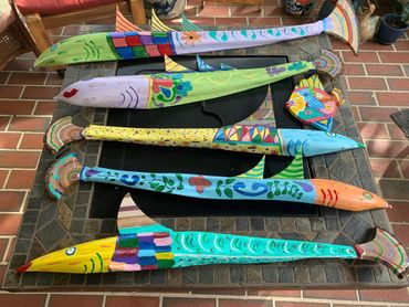 Five painted wooden fish