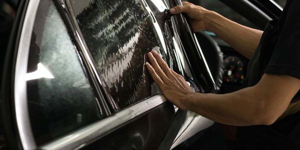 trimming the window film or tint to an exact fit is the standard procedure here at Holy Grail Detail