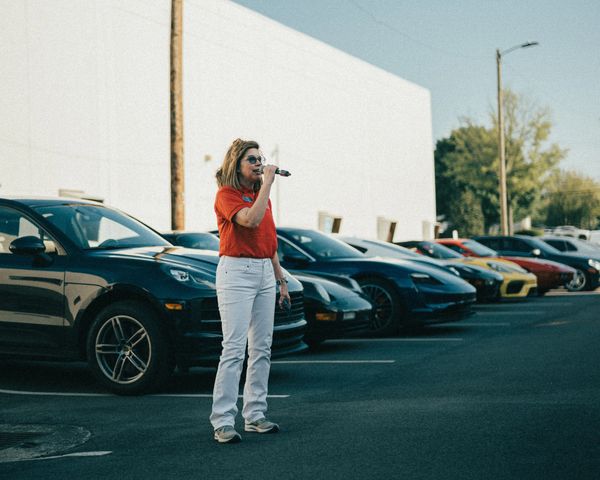 Porsche club president speaking at the Porsche club meeting at Wolfpen European Auto Repair Roswell